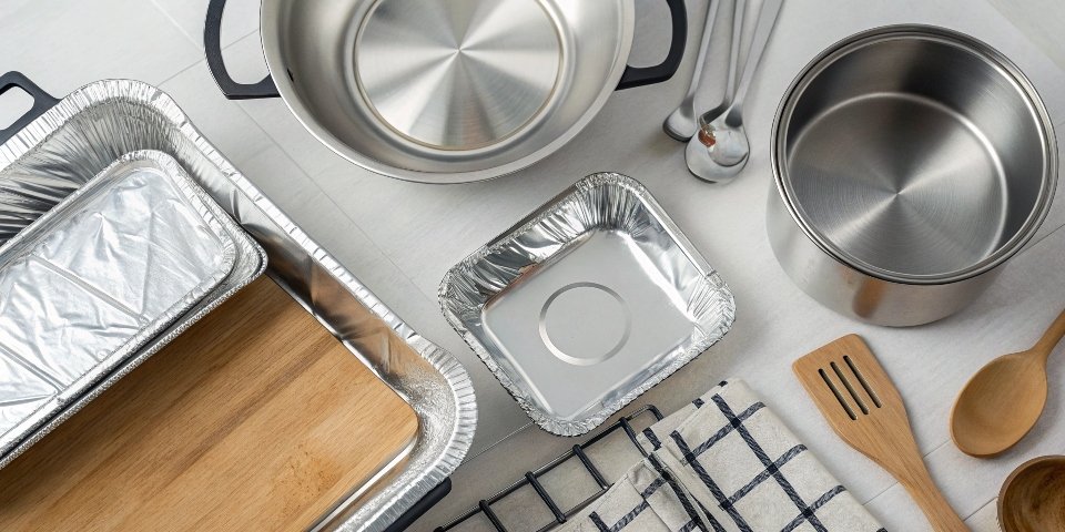 Aluminum in the Home An overhead shot of a modern kitchen showing aluminum cookware, foil, and utensils