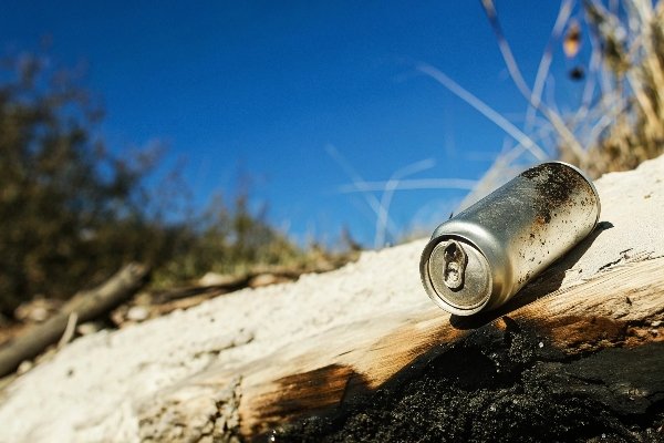 alt with keywords: A small, lumpy piece of melted and recrystallized aluminum found in the ashes of a fire