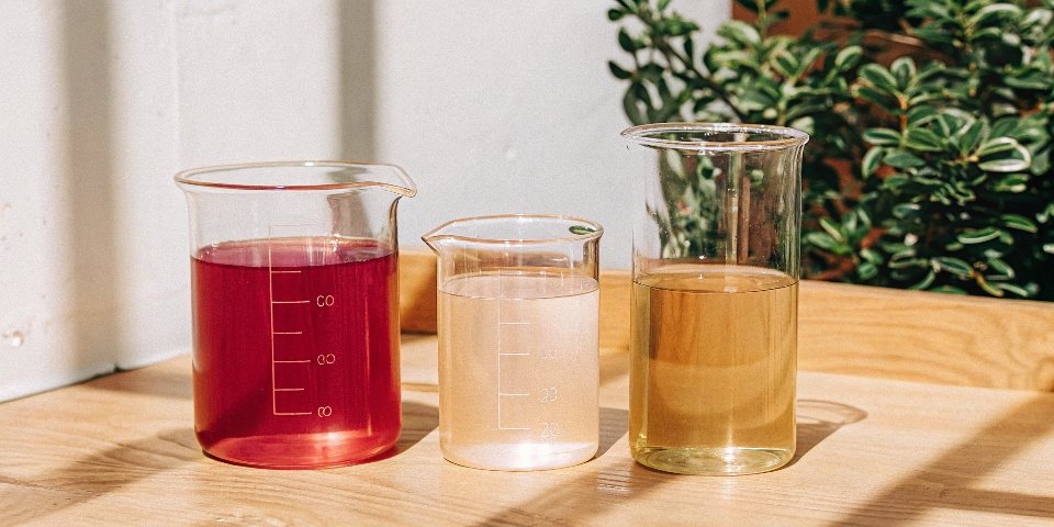 A series of three beakers: 1) clear metal salt solution, 2) add some NaOH to form a white precipitate, 3) add excess NaOH and the precipitate vanishes