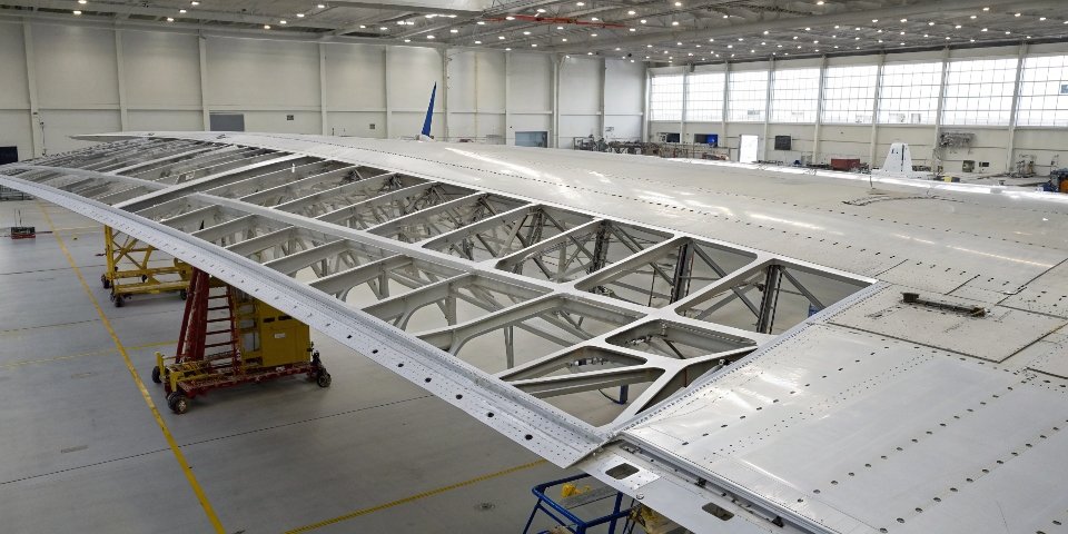 Aluminum Alloys in Aerospace Industry A shot of an airplane wing under construction, highlighting the aluminum alloy framework