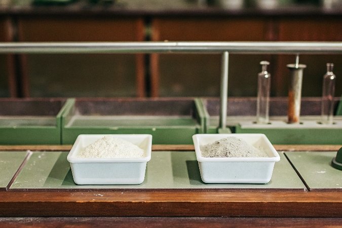 alt with keywords: A laboratory bench showing white powders labeled ATH and MDH side-by-side