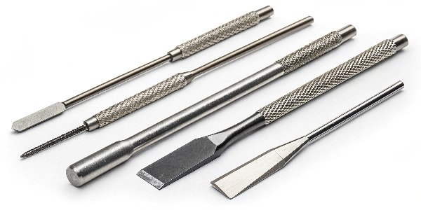 A collection of different [metal skimming tools](https://en.wikipedia.org/wiki/Betterton%E2%80%93Kroll_process)[^6], showing various shapes and designs for different applications.