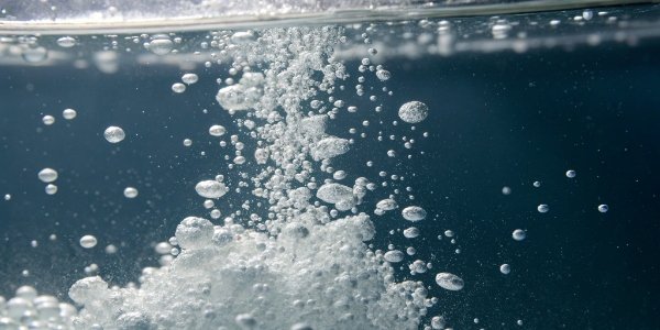 A close-up view of aluminum hydroxide particles suspended in water