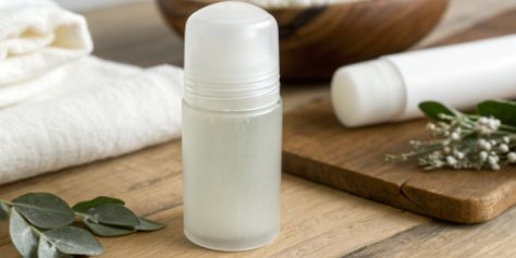 A roll-on deodorant bottle with an ingredient list highlighting aluminum hydroxide