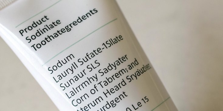Check Toothpaste Ingredients A toothpaste label with Sodium Lauryl Sulfate (SLS) circled