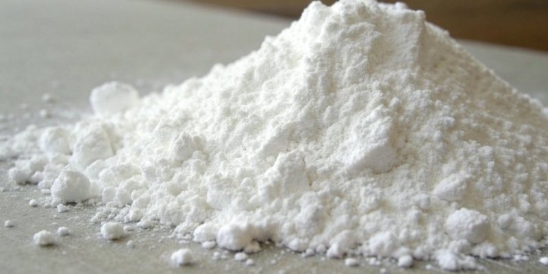 A close-up of white aluminum hydroxide powder
