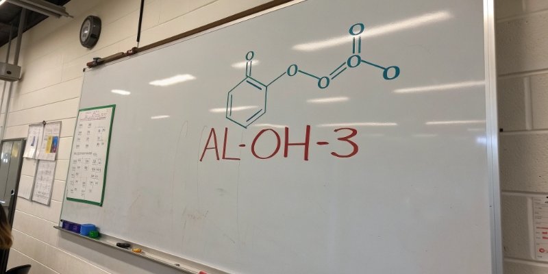 Chemical Names for Aluminum Hydroxide A chemical formula diagram of Al(OH)3 shown on a whiteboard.