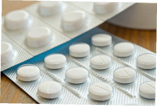 Aluminum Hydroxide in Antacids A close-up of over-the-counter antacid tablets next to their packaging.